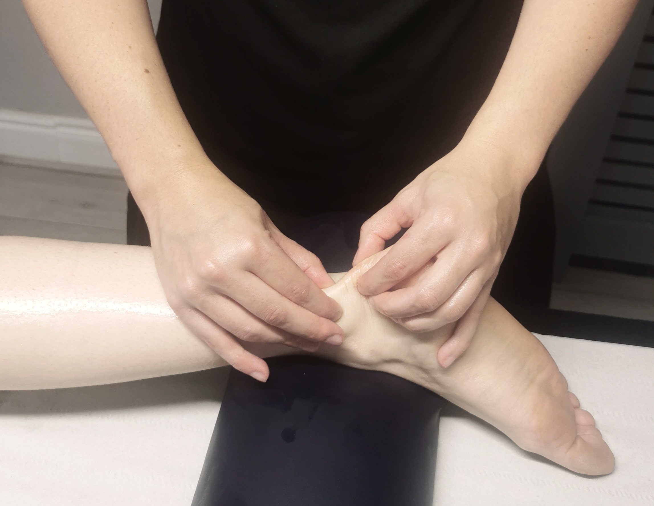 Stretching the clients achilles tendon